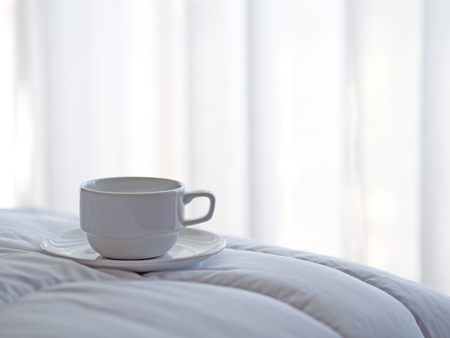 Fresh morning coffee on the bed.の写真素材