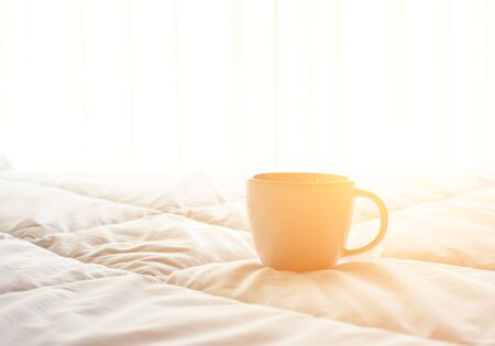 Fresh morning coffee on the bed.の写真素材