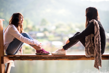 Women are siting on the terrace at resort on enjoy with the outside natureの写真素材