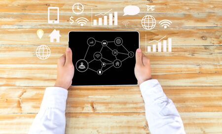 Man hand holding laptop seeing business, technology, internet and networking conceptの写真素材