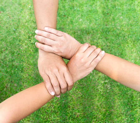 concept of teamwork. business people joined handsの写真素材