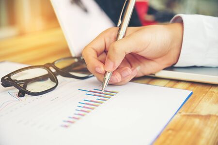 Business concept with money and documents graph, report finance, businessman writing graphの写真素材