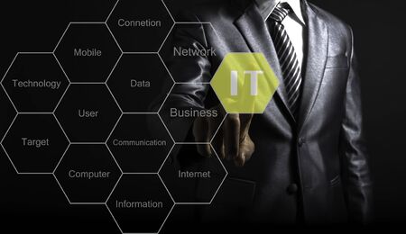 Businessman touch IT consultant presenting tag cloud about information technologyの写真素材