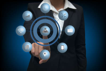 Busines  women pressing virtual media type of buttonsの写真素材