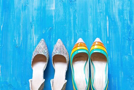 Collection of women's shoes on blue backgroundの写真素材