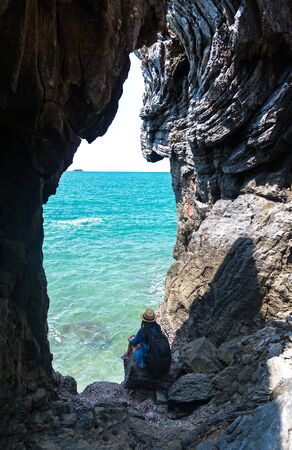 Travel women in a cave near the sea in Keo Sichang, Thailandの写真素材