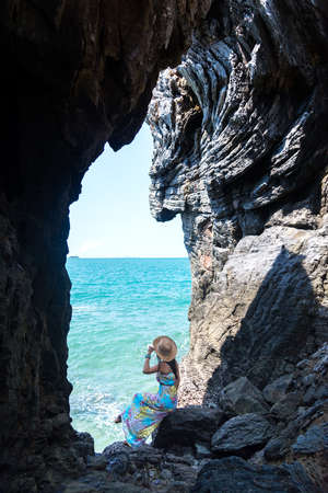 Travel women in a cave near the sea in Keo Sichang, Thailandの写真素材