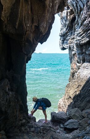 Travel women in a cave near the sea in Keo Sichang, Thailandの写真素材