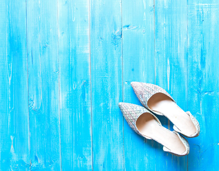 Collection of women's shoes on blue backgroundの写真素材