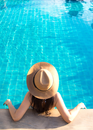 Women relaxing near luxury swimming poolの写真素材