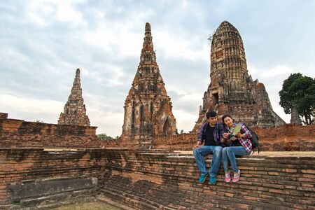 Traveler man and women with backpack walking in temple Ayuttaya ,Thailand, soft and select focusの写真素材