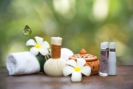 Spa massage compress balls, herbal ball and treatment  spa, Thailand, background green natureの写真素材