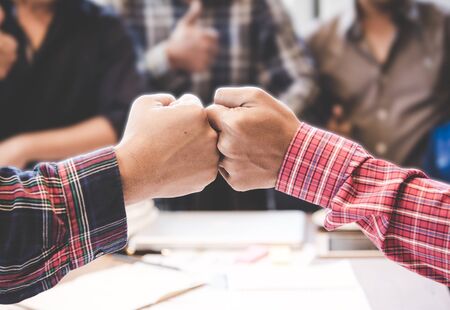 Businessman and engineer working hands of business people join hand together. Teamwork Concept.の写真素材