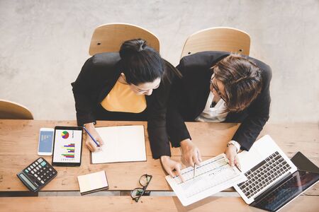 Top view business partners discussing graph of financial, business conceptの写真素材