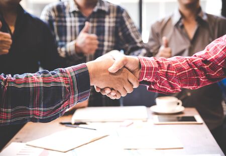 Engineers shaking hands for success.の写真素材