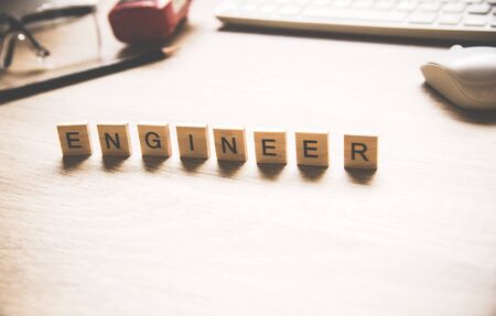 Words of engineer concepts collected in crossword with wooden cubes. Engineer Concept