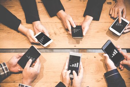 Business team using tablet computer to work with financial data.  Partners discussing graph of report growth.  Business Concept.の写真素材