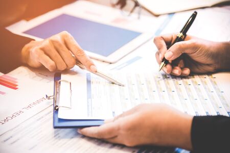 Business partners discussing graph of financial, select focus.  Business Conceptの写真素材