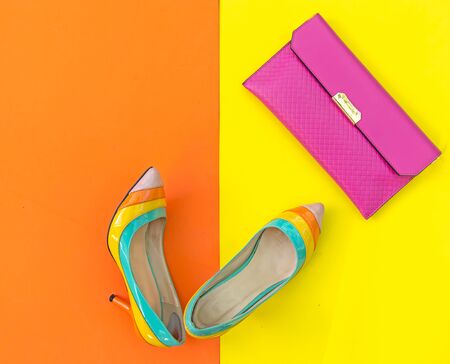 Fashion woman accessories set. Trendy fashion shoes heels, stylish handbag clutch. Colorfull background.  Lifestyle Concept.の写真素材
