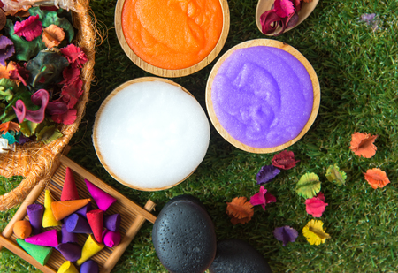 Spa Thai setting for aroma therapy and sugar and salt massage with flower on the bed, relax and healthy care.  Healthy Conceptの写真素材