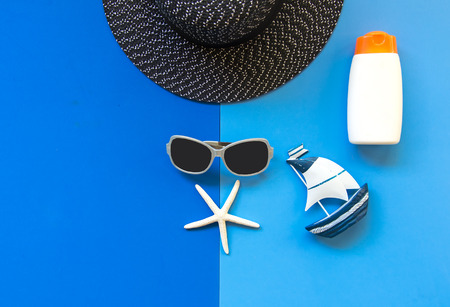 Summer Fashion woman big hat and accessories in the beach. Tropical sea.Unusual top view, colorfull background.  Summer Concept.の写真素材