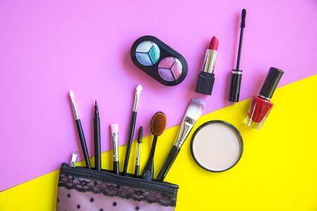 Cosmetics and fashion background with make up artist objects: lipstick, eye shadows, mascara ,eyeliner, concealer, nail polish.  Lifestyle Conceptの写真素材