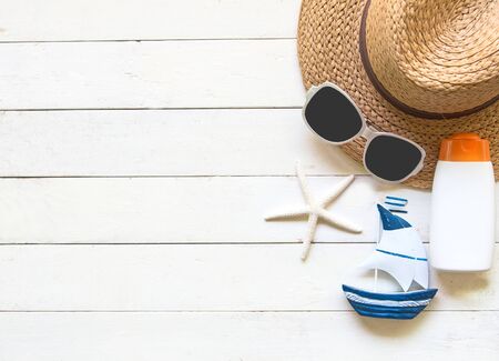 Summer Fashion woman big hat and accessories in the beach. Tropical sea.Unusual top view, colorfull background.  Summer Concept.の写真素材