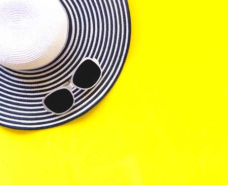 Summer Fashion woman big hat and accessories in the beach. Tropical sea.Unusual top view, colorfull background.  Summer Concept.の写真素材