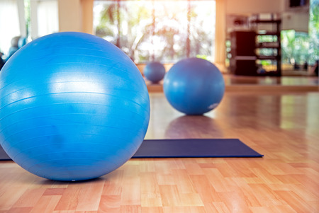 Yoga ball and map yoga in fitness room.  Healthy Conceptの写真素材
