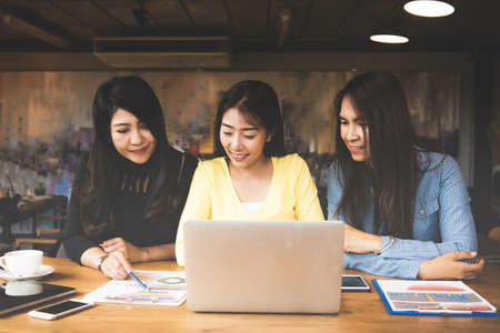 Business asia women partners discussing graph of financial in work space,casual outfit. Business Conceptの写真素材
