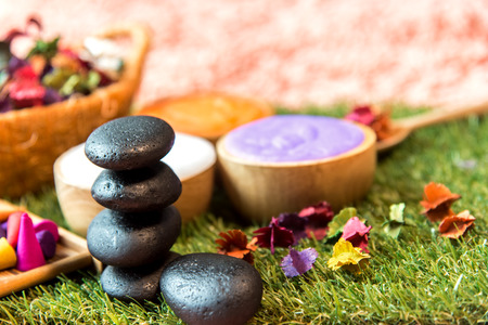Spa Thai setting for aroma therapy and sugar and salt massage with flower on the bed, relax and healthy care.  Healthy Conceptの写真素材