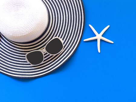 Summer Fashion woman big hat and accessories in the beach. Tropical sea.Unusual top view, colorfull background.  Summer Concept.の写真素材