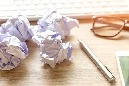 Business workplace with keyboard mouse and crumpled paper balls ,papers with graphs and diagrams .  Business Conceptの写真素材