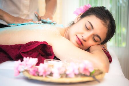 Masseur doing massage spa with treatment on Asian woman body in the Thai spa lifestyle, so relax and luxury.  Healthy Conceptの写真素材