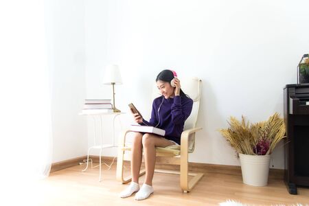 Inspired young asian woman listening the music at home, relax and happy life.  Lifestyle Conceptの写真素材