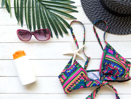 Summer Fashion woman bikini, big hat and accessories and sunglasses go to travel in the beach....