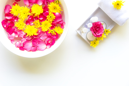 Thai Spa relax Treatments and massage with pink rose and yellow flower on wooden white.  Healthy Concept. select and soft focusの写真素材