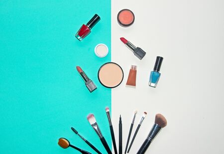 Cosmetics white and blue background with make up artist objects: lipstick, eye shadows, mascara ,eyeliner, concealer, nail polish.  Lifestyle Conceptの写真素材