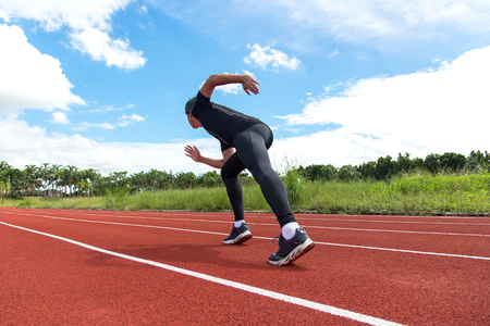 Sport and fitness runner man running on racetrack training for the winner and target.の写真素材