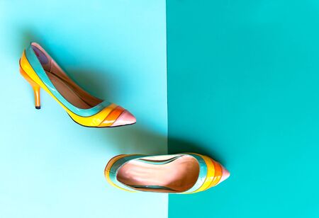 Fashion woman accessories set. Trendy fashion shoes heels, stylish big hat. Colorfull greeen and blue background.  Lifestyle Concept.の写真素材