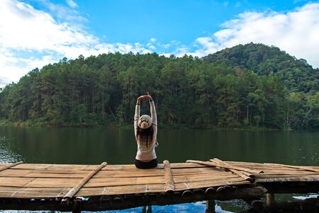 Women are siting on the terrace at resort on enjoy and relax with the outside nature, Meahongsorn Thailand.  Lifestyle and travel Conceptの写真素材