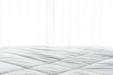 Mattress bed sheet, duvet and pillow, messed up in the morning in the bed roomの写真素材