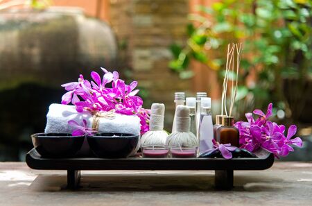 Thai Spa Treatments aroma therapy  salt and sugar scrub and rock massage with orchid flower on wooden white.  Healthy Concept. copy space,select and soft focusの写真素材