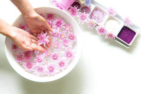 Spa treatment and product for female feet and manicure nails spa with pink flower, copy space, soft and select focus, Thailand. Healthy Concept.の写真素材