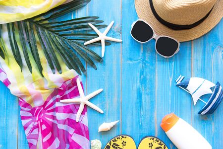 Summer Fashion woman big hat and accessories, vintage camera and sunglasses go to travel in the beach. Tropical sea.Unusual top view,  background.  Summer Concept.の写真素材