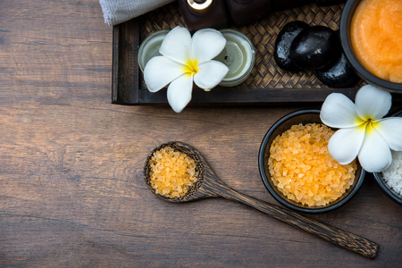 Spa Thai setting for aroma therapy and sugar and salt massage with flower on the bed, relax and healthy care.  Top vie, copy space.  Healthy Conceptの写真素材