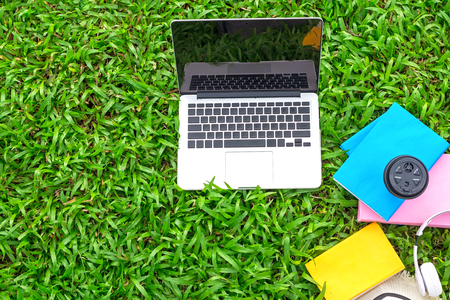 Top View.  Enjoy listening music with cup coffee on the grass field of the park in the morning.  Lifestye Conceptの写真素材