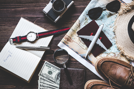 Top view of Traveler accessories and items man with black for planning travel vacations on the world, copy space.  Travel and Summer holiday conceptの写真素材