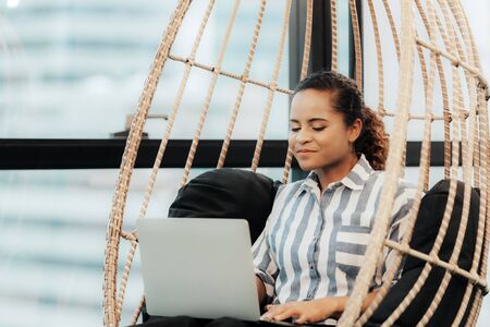 Business women using tablet computer to work with financial data in the modern office, relax and rest time after work.  Business Concept.の写真素材