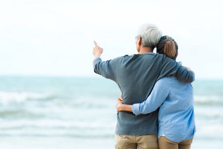 Asian Lifestyle senior couple hug on the beach happy in love romantic and relax time.Â  Tourism elderly family travel leisure and activity after retirement in vacations and summer.の写真素材